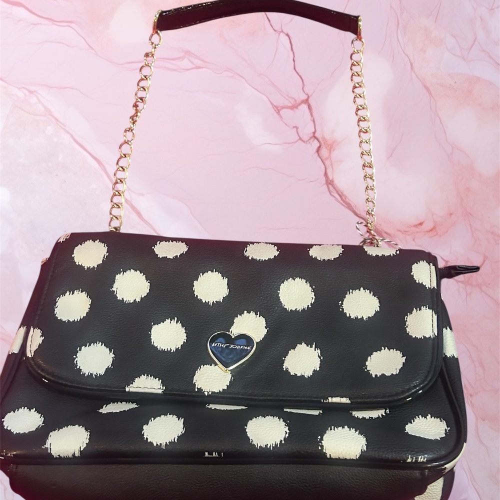 Betsy Johnson white and black print shoulder bag with gold tone chain.
